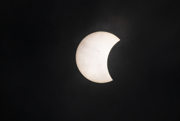 The moon's shadow continues to cover the sun's surface at 12:45p.m  on Monday, April 8.