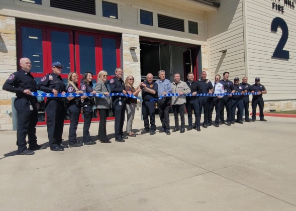County Commissioner Cynthia Long, center, and Liberty Hill Fire Chief Anthony Lincoln cut the ribbon to open the new county EMS station. Photos by Nalani Nuylan.