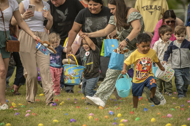 3-year-old Ezra Garcia wears a big smile as mom Ashley Gracia holds his hand during the City of Taylor's Easter Egg Hunt held Saturday, March 30, 2024 at Taylor's Memorial Stadium on Davis Street.