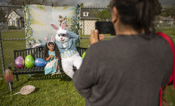 Jeanette Rodriguez, right, takes photos of her granddaughter Camila Mendez, 6, as Camila visits the Easter Bunny  during the City of Taylor's Easter Egg Hunt held Saturday, March 30, 2024 at Taylor's Memorial Stadium on Davis Street.