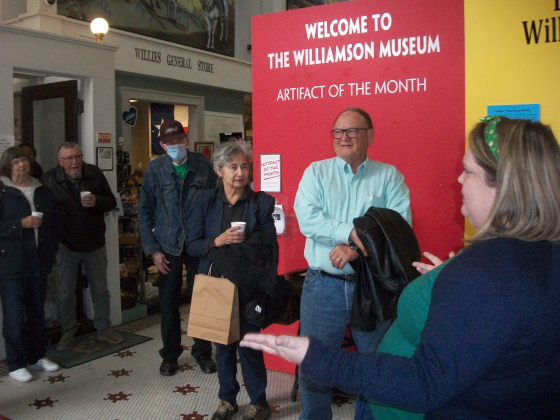 Danelle Houck (right foreground), educator for the Williamson Museum, leads a Camille’s Memory Café tour group March 17. Participants learned about District Attorney Dan Moody and his successful 1923-24 prosecution of four Ku Klux Klan members. Photo by Brad Stutzman