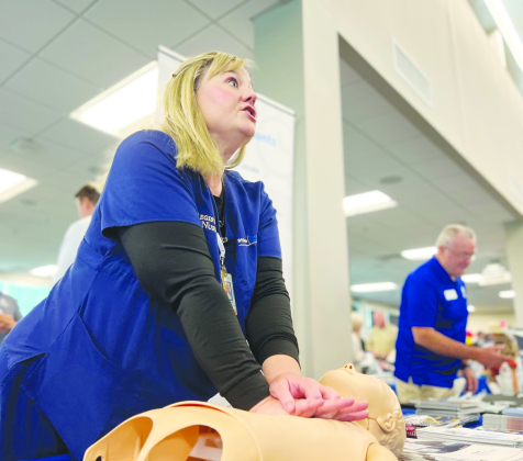 Kristen Hullum, trauma injury prevention coordinator at St. David's Round Rock Medical Center leads a CPR training. 