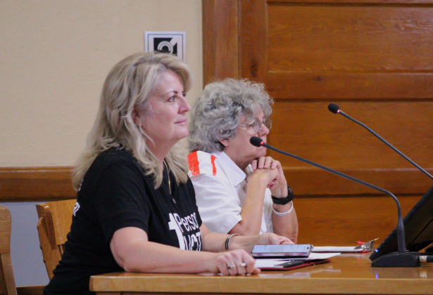 Marcia Waston from Citizens Defending Freedom, left, joined by resident Cathy Jaster speaks to Item 24 regarding the Secretary of State Advisory during the July 2 Commissioners Court meeting. Photo by Nalani Nuylan.