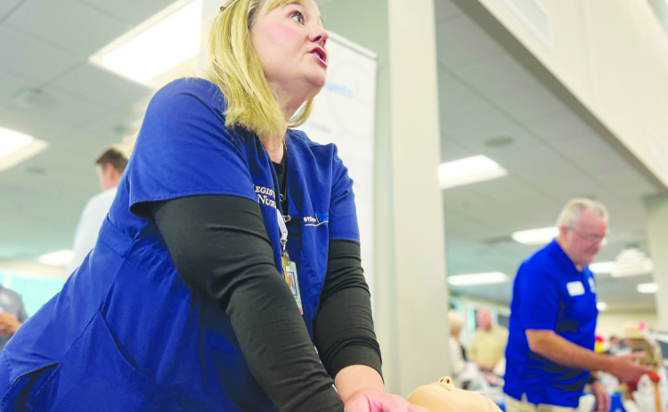 Kristen Hullum, trauma injury prevention coordinator at St. David's Round Rock Medical Center leads a CPR training. 